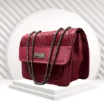 Maroon crescent shoulder bag front view in faux leather