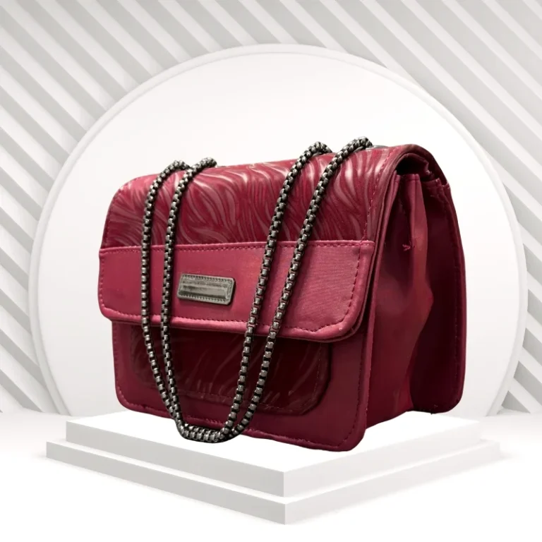 Maroon crescent shoulder bag front view in faux leather