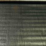 Peel and stick self-adhesive wooden sheet applied to furniture surface