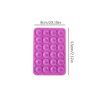 Reusable silicone suction cup phone holder on glass surface