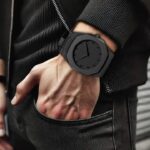 Matte black octagonal watch front view with minimalist dial