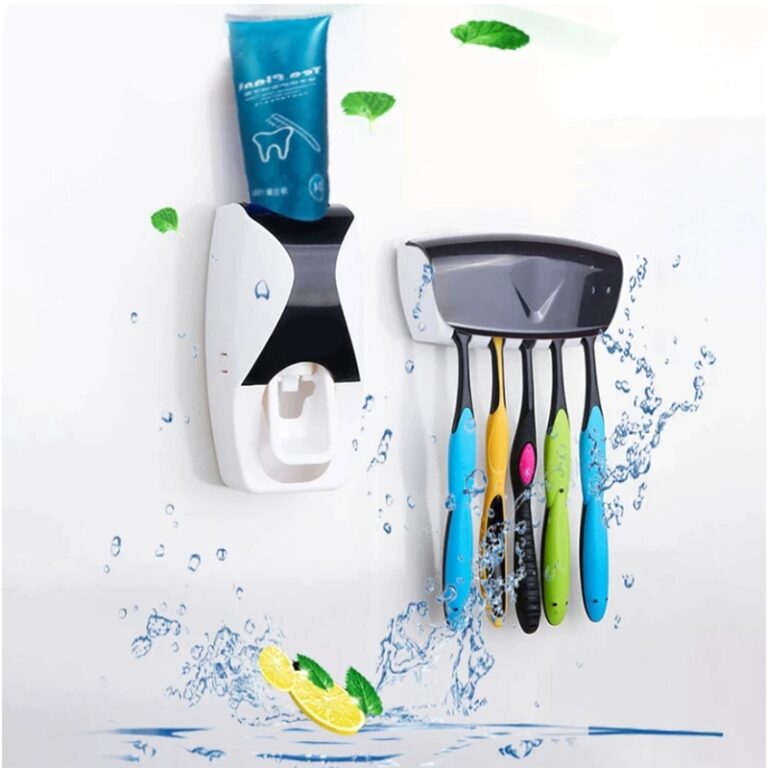 Automatic toothpaste dispenser mounted on bathroom wall with toothbrush holder