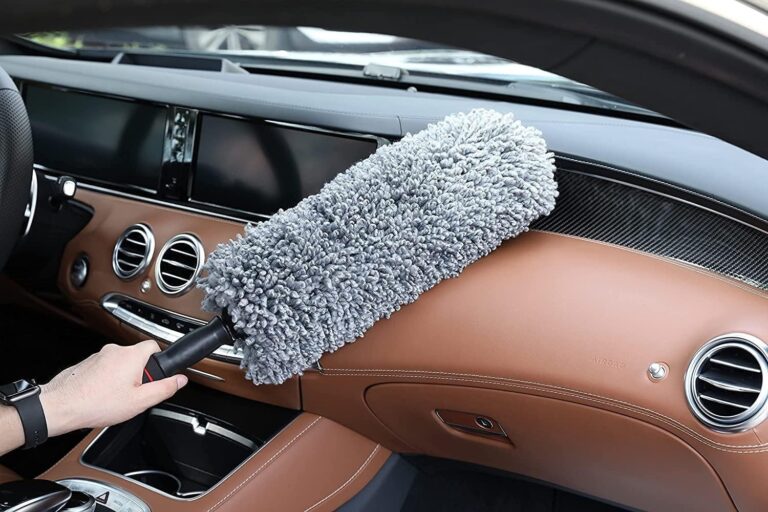 Microfiber car duster with telescopic handle on white background