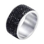 Close-up of stainless steel ring with cubic zirconia inserts
