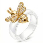 Close-up of 18K gold plated bee ring with cubic zirconia on stainless steel