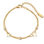 Close-up of 18K gold plated stars bracelet with cubic zirconia on wrist