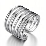 Adjustable stainless steel ring on white background