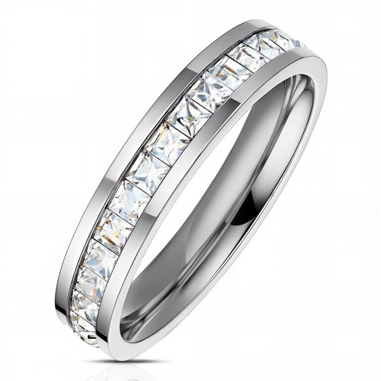 Stainless steel ring with cubic zirconia inlays on white background