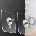 4 punch-free screw hangers on white background