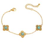 Close-up of 18K gold plated flower meadow bracelet on white background