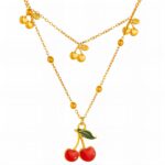 Close-up of 18K gold plated cherry pendant necklace with enamel detail