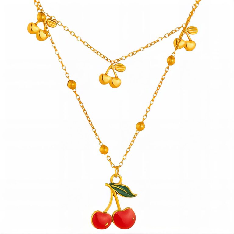 Close-up of 18K gold plated cherry pendant necklace with enamel detail