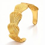 18K gold plated stainless steel seashell bracelet on white background