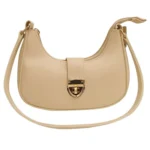 Crescent luxury shoulder bag in skin color with gold lock closure