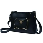 Black handbag with metallic cat-shaped handle and gold accents front view