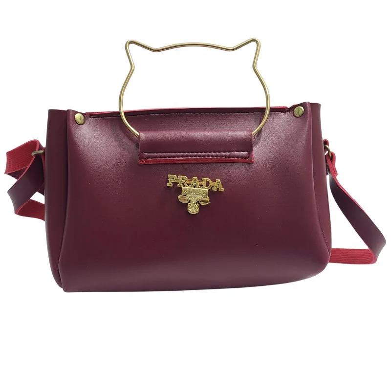 ProductImage-2025-12-13T182549.007_1765632559.webp Front view of elegant cat handle handbag with gold accents