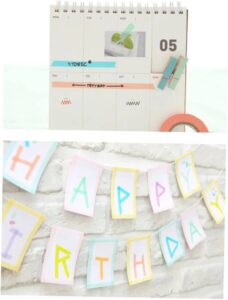Colorful rolls of rainbow washi tape stacked together