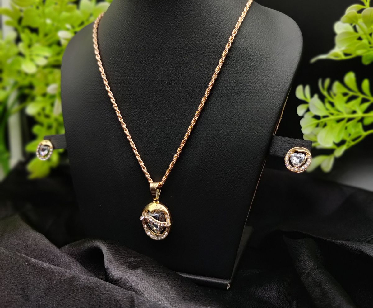 WhatsApp-Image-2025-02-03-at-10.44.48-PM-1.jpeg Elegant gold pendant necklace set with radiant crystals and stud earrings
