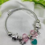 Elegant imported Pandora bracelet with heart and love charms on wrist