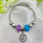 Elegant Pandora bracelet with rose pendant and purple blue beads