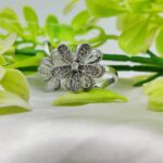 Adjustable blooming flower ring in gold on hand