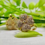 Imported moveable floral ring with golden petals and crystals