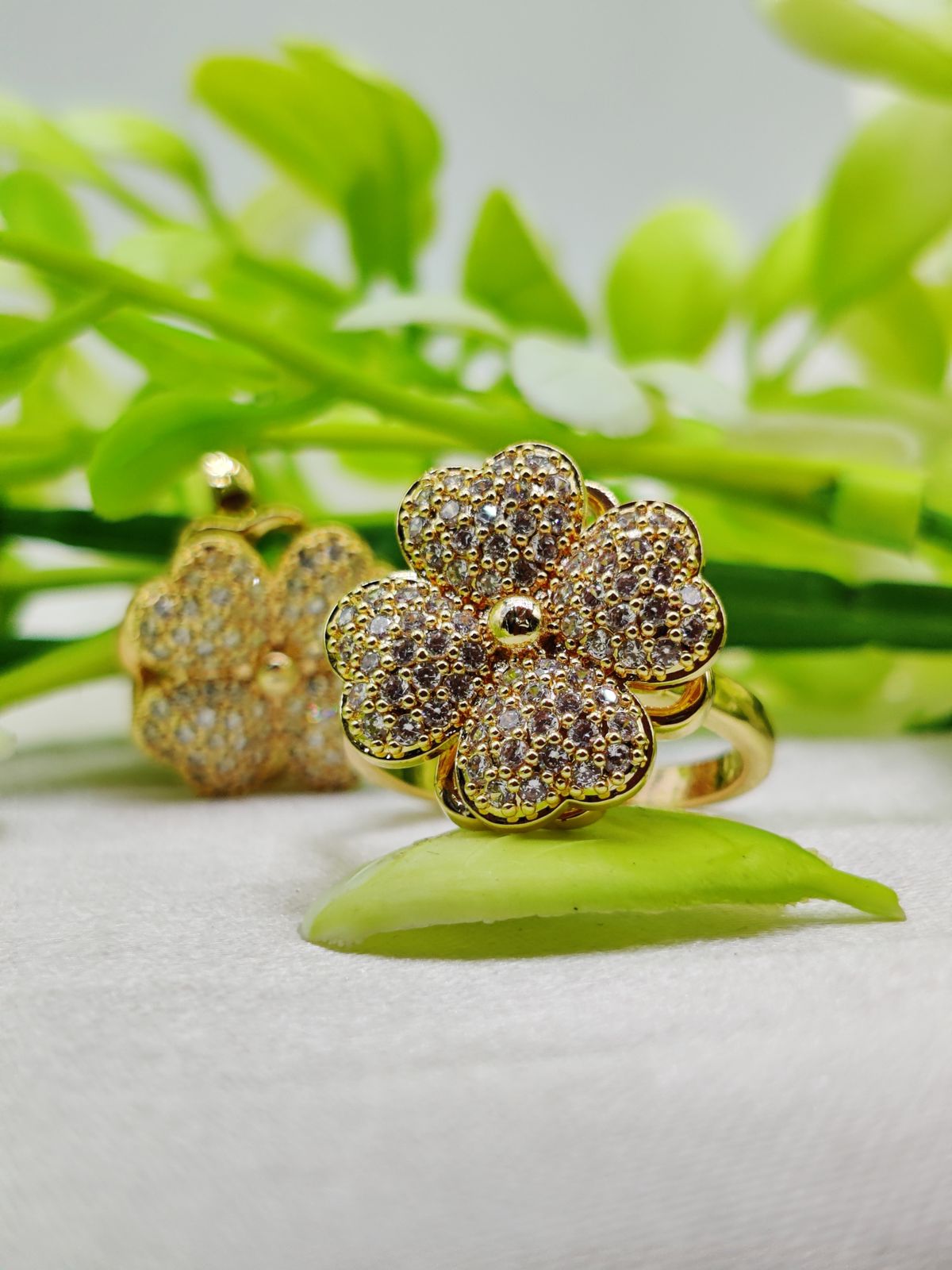 WhatsApp-Image-2025-02-05-at-3.35.35-AM-1.jpeg Imported moveable floral ring with golden petals and crystals