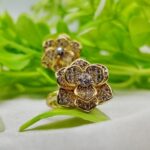 Close-up of adjustable Petal Bloom ring in gold with crystal petals
