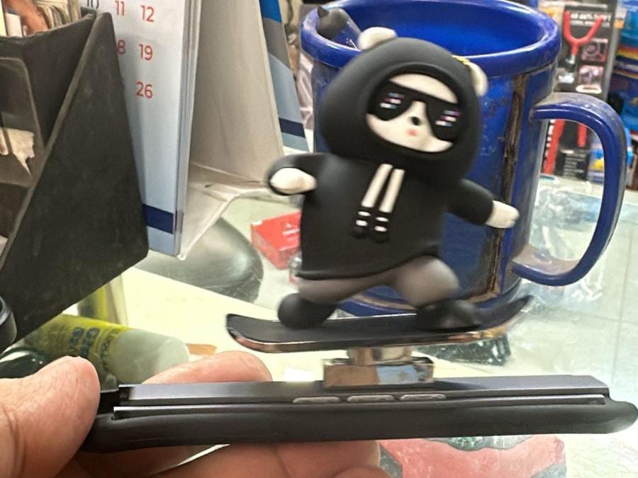 black metal skateboard bear car dashboard decoration front view
