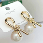 Knot pearl clip-on earrings with silver grey freshwater pearls front view