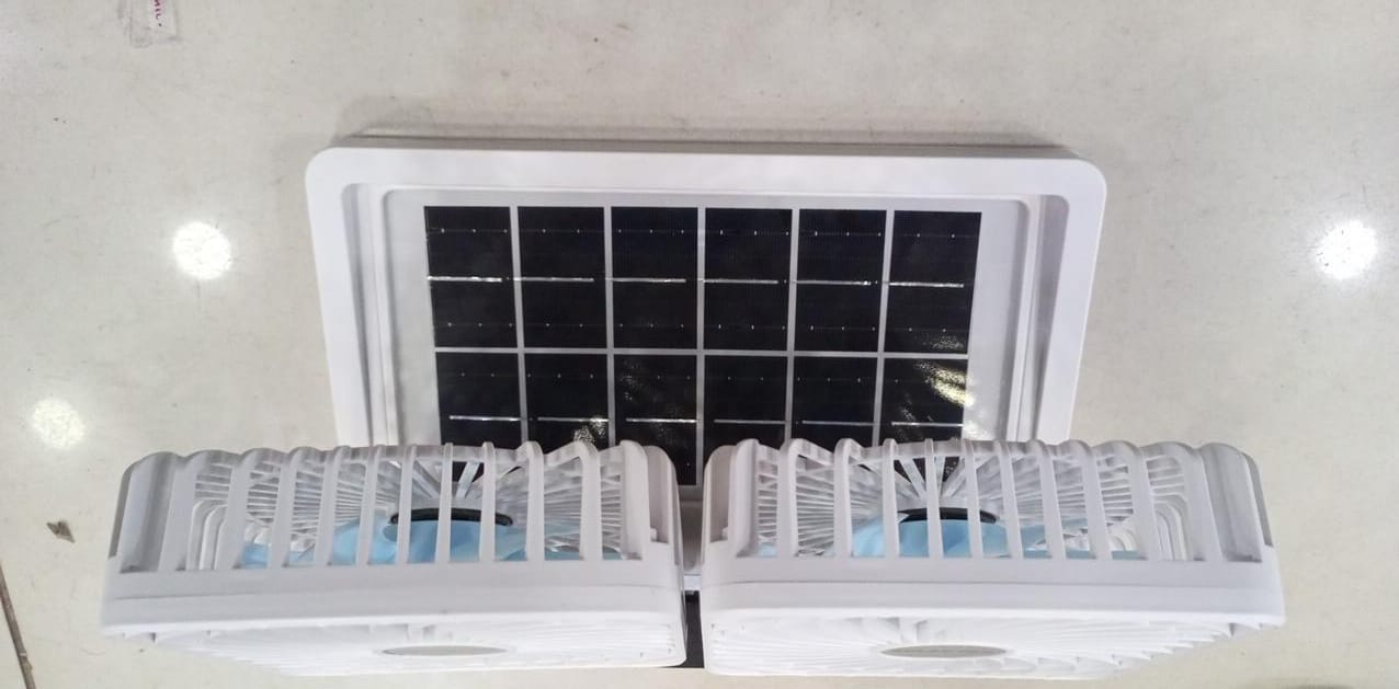 WhatsApp-Image-2025-03-20-at-1.42.21-PM-1.jpeg Double head solar portable fan side view on desk