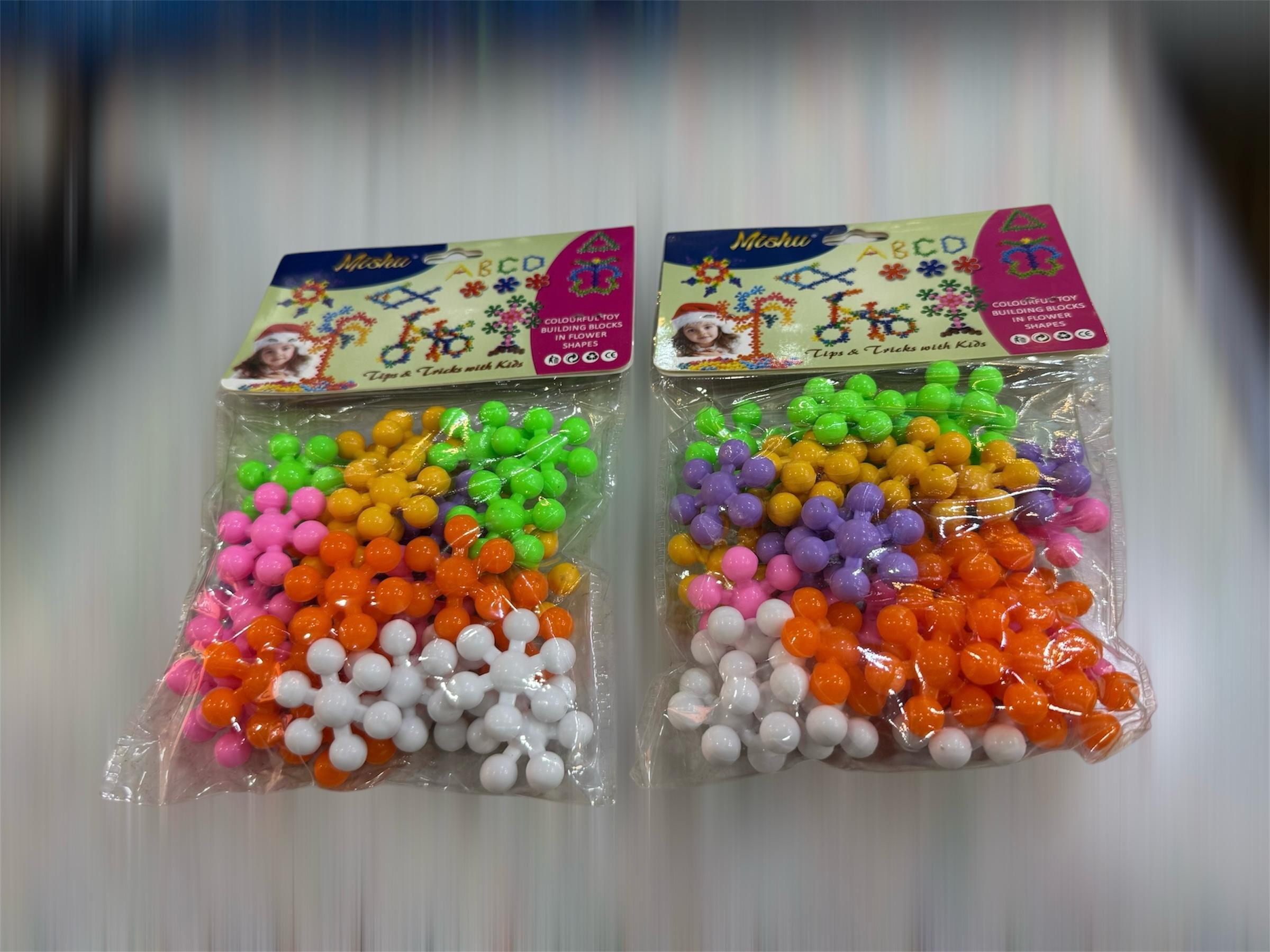 WhatsApp-Image-2025-04-29-at-2.21.38-PM.jpeg 32 pcs Snowflakes Colorful Toy Building Blocks Flower-Shaped Set | Plastic colorful snowflakes toy - Image 1
