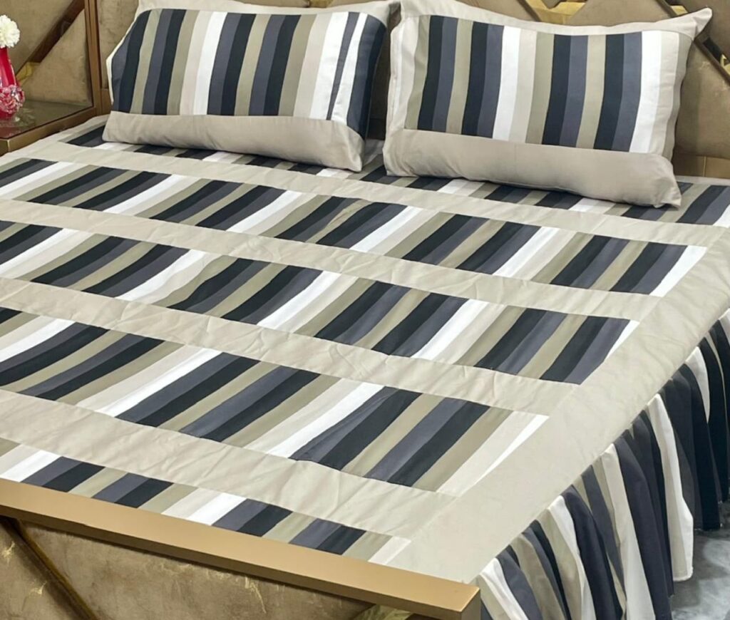 Multicolor frill patchwork double bedsheet set folded on bed
