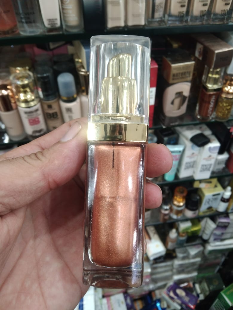 WhatsApp-Image-2025-07-30-at-5.22.33-PM.jpeg Huda Beauty N.Y.M.P.H. All Over Body Highlighter – Liquid Illuminator for Face, Body & Legs – Water-Based, Long-Lasting Glow – 35 ml - Image 1
