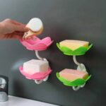 Lotus flower wall-mounted soap holder on bathroom wall