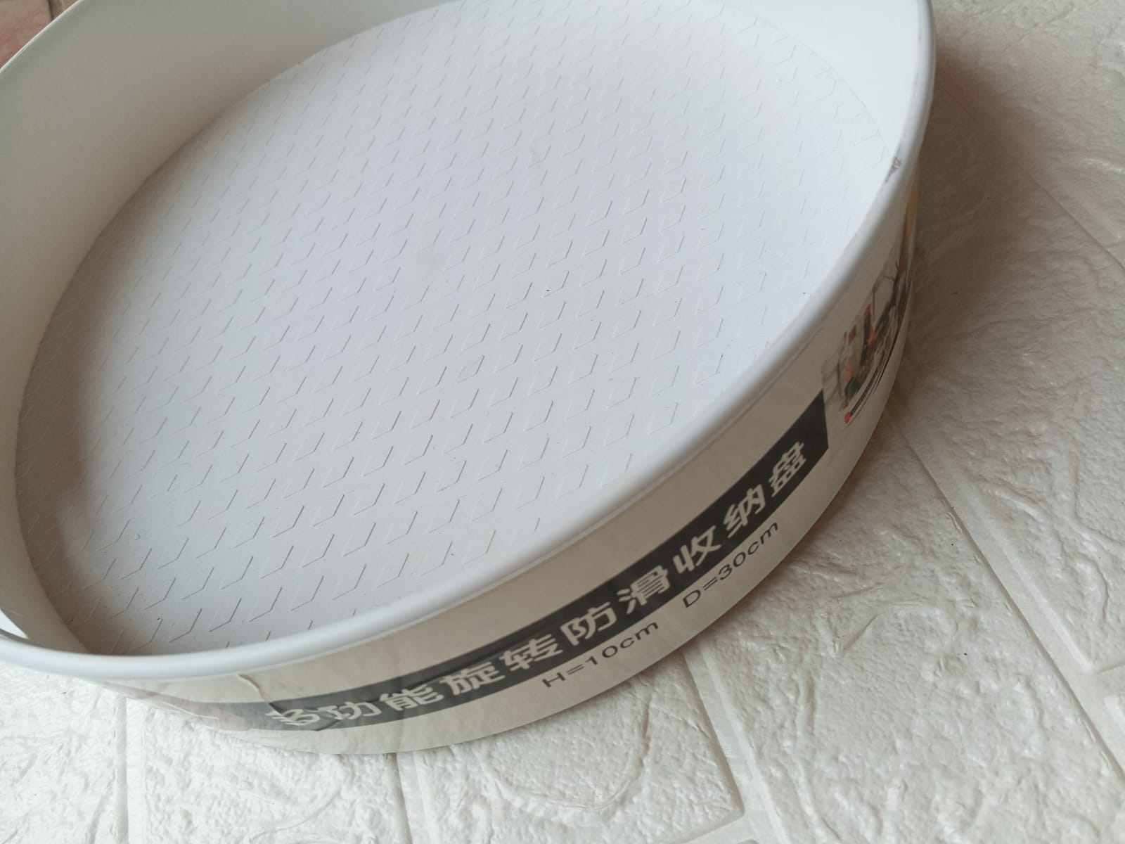 WhatsApp-Image-2025-08-31-at-4.45.49-PM-1.jpeg Large rotating storage box with open handles on dining table