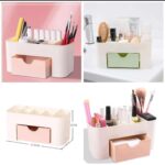 Plastic makeup organizer with compartments and drawer on desk