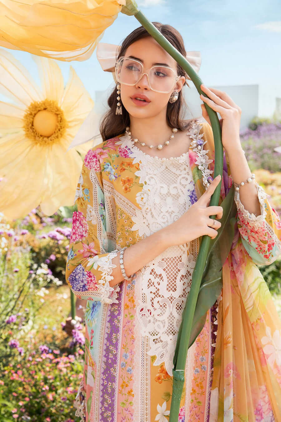 c446cc269f580650245d7674ae432322.jpg Front view of multi floral embroidered lawn 3 piece unstitched suit