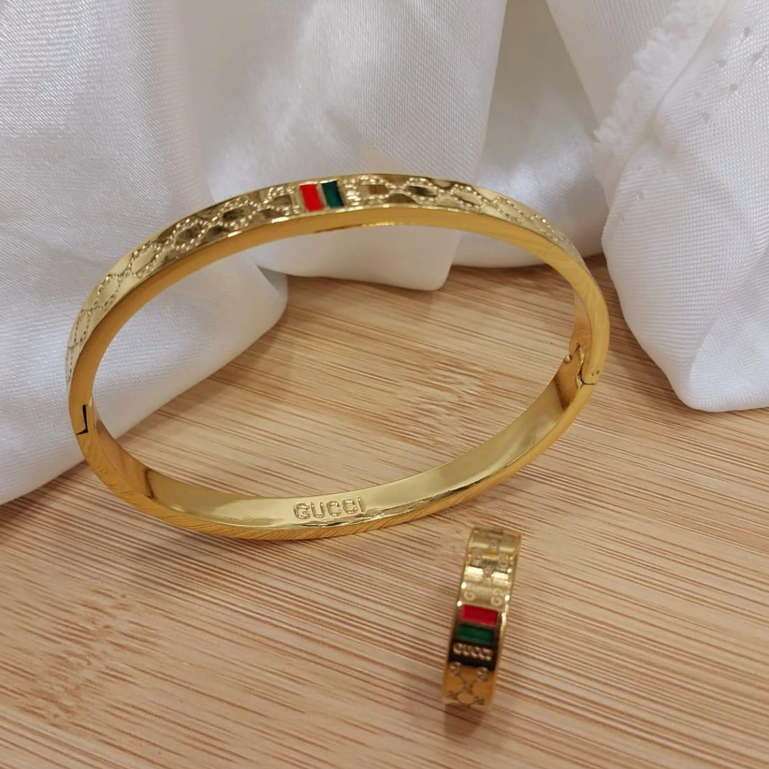 f352e0cea22fea73cc132f86be127001.jpeg Gold plated stainless steel bangles and matching ring set